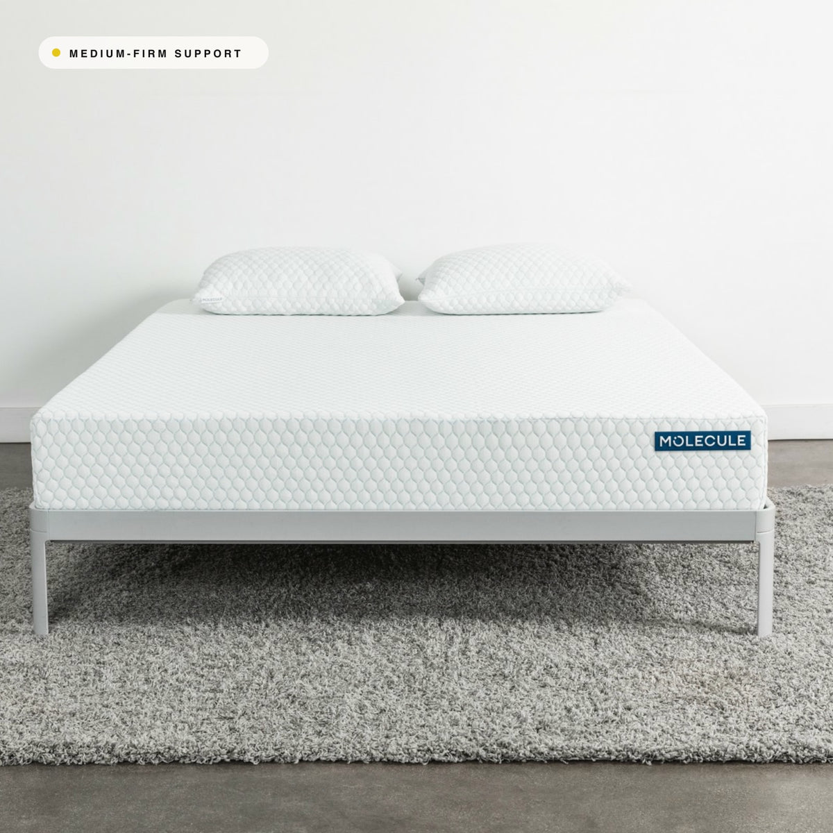 MOLECULE Core 10 mattress on a bed frame in a bright modern bedroom