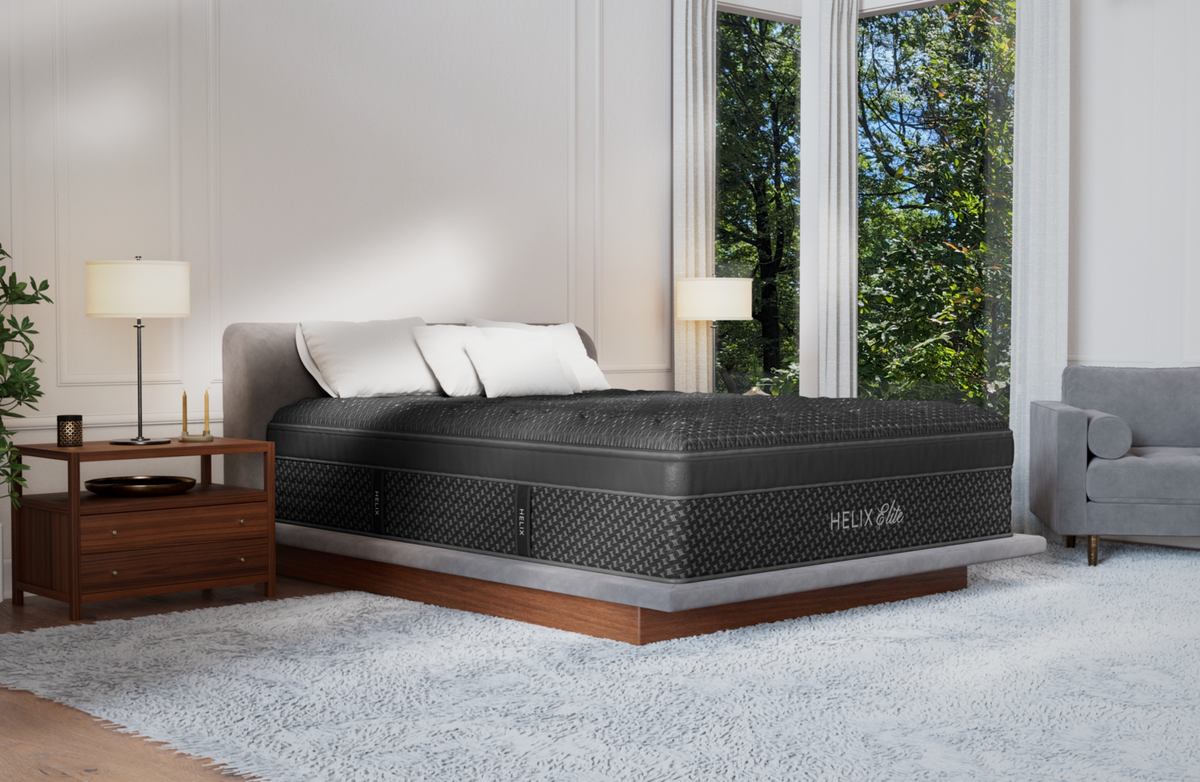 Helix Midnight Elite mattress corner view in a bedroom